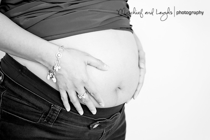 maternity_Photography_4 Black and White photo of a woman holding her belly
