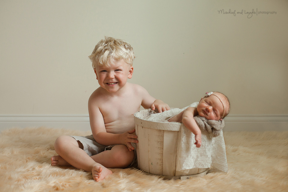Newborn with sibling pose in basket, Mischief and Laughs, Cincinnati OH
