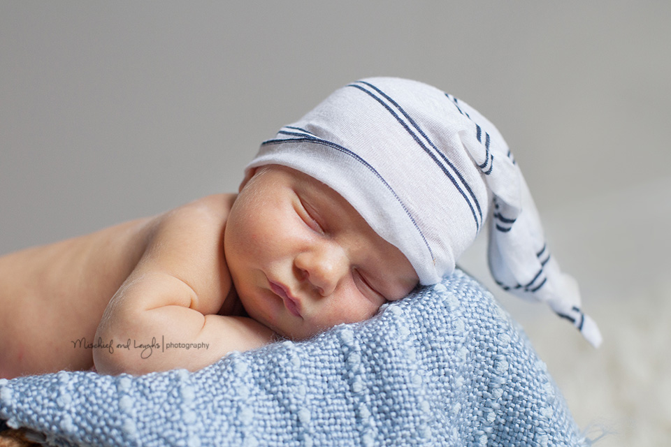 Newborn with sleeping cap, Rochester Newborn Photographer, Mischief and Laughs Photography
