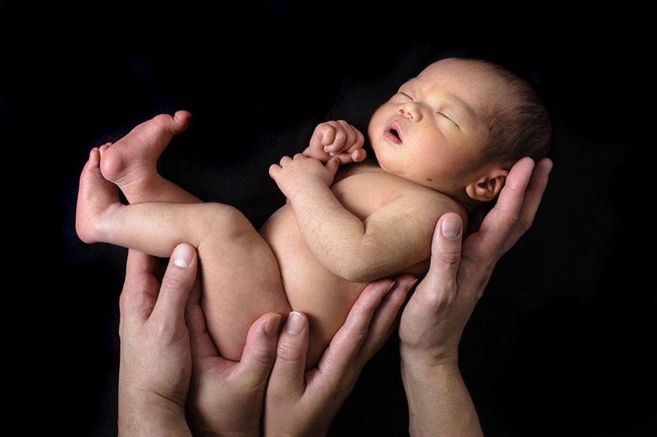 Baby held in parents hands newborn photos cincinnati