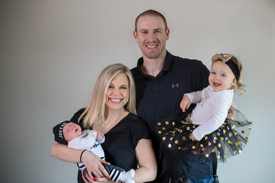 family poses for newborn portrait session