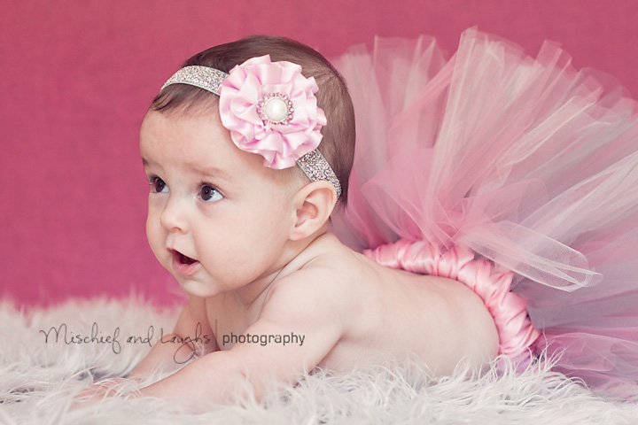 Cincinnati based child photographer takes picture of baby in a tutu