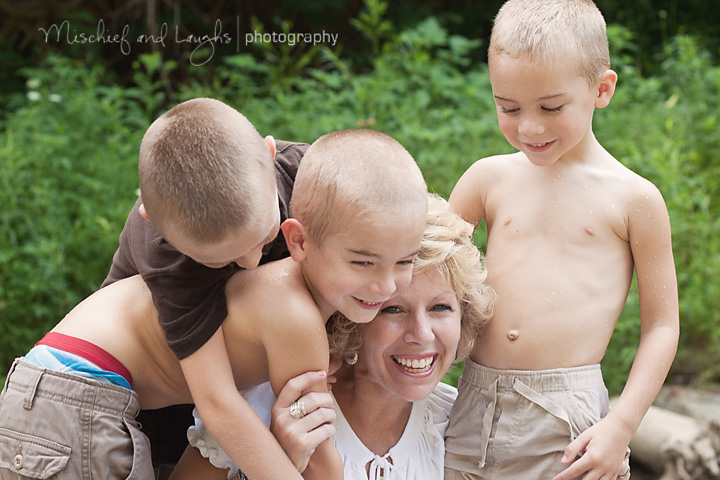 mom shares a laugh with her boys