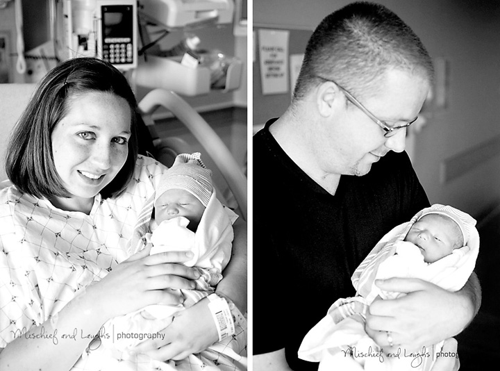 Mom and dad hold their newborn son