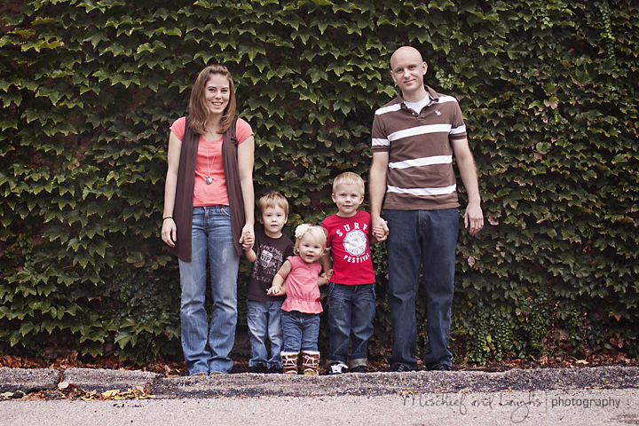 family poses for portraits