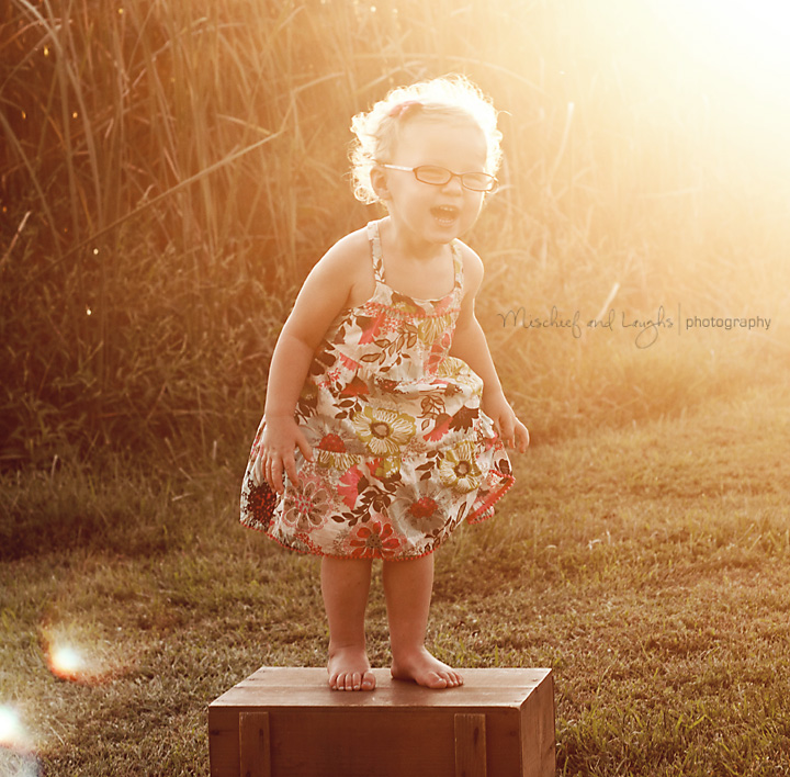 Child has portrait taken in the sunshine