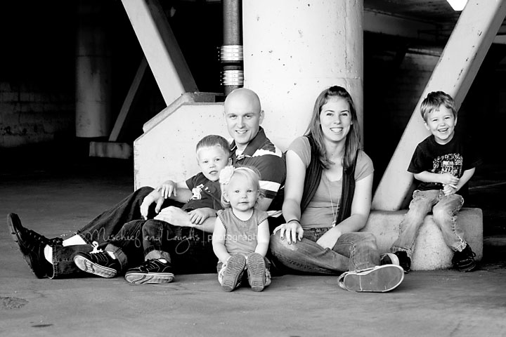 family poses for their photographer