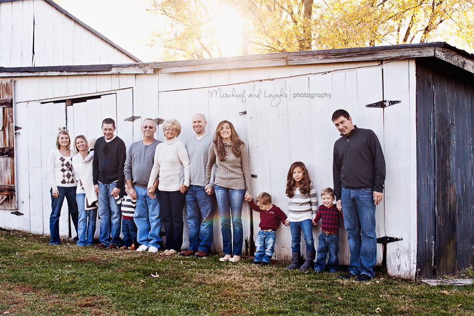 the family's white barn serves as a perfect backdrop for family portraits