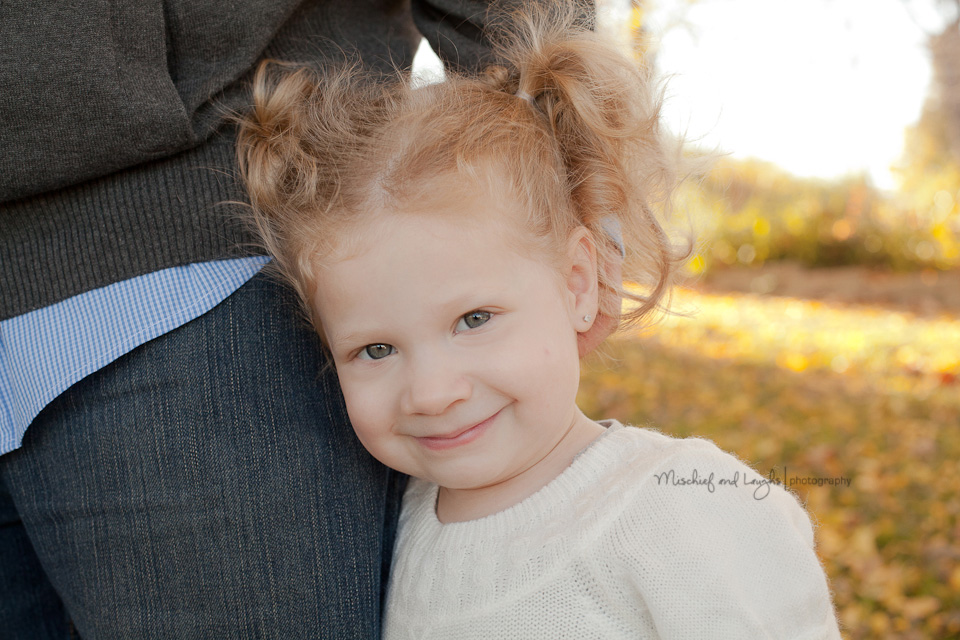 two year old girl smiling for photo session