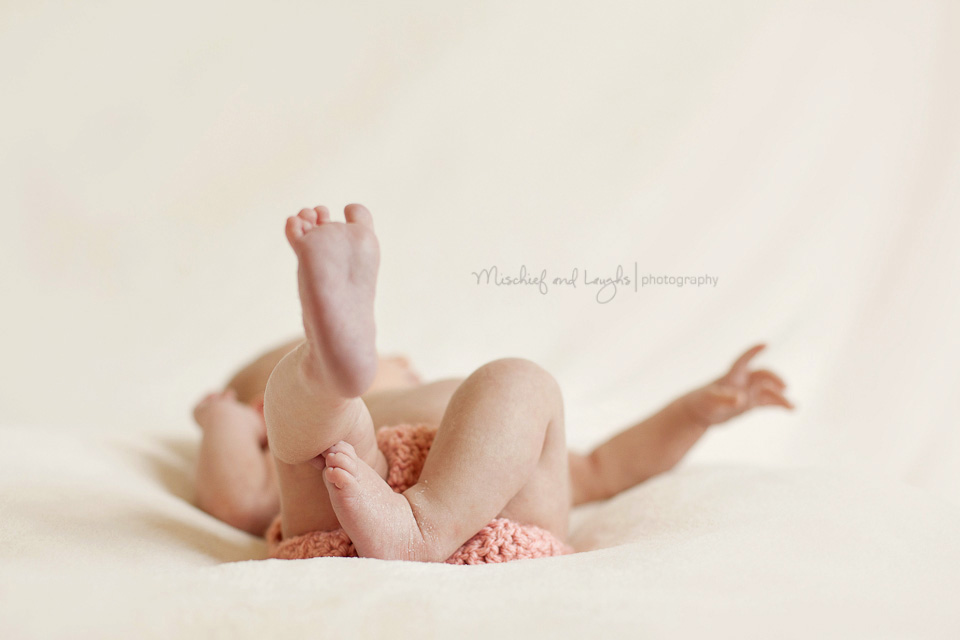 little thin newborn baby legs and tiny feet