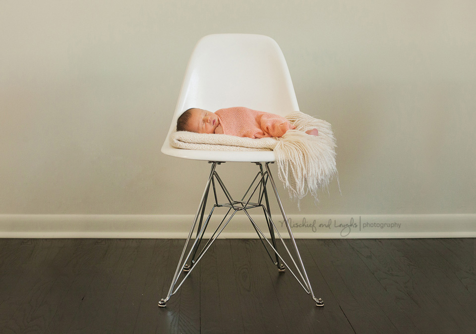 Eames shell chair and a Newborn baby, Mischief and Laughs Photography, Cincinnati OH