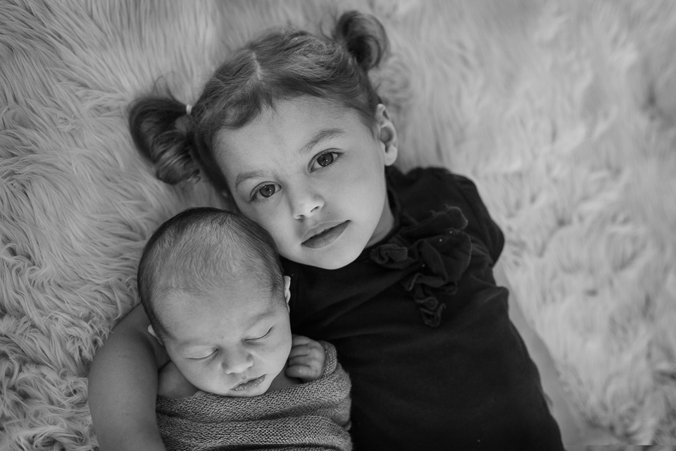 Baby boy and big sister, black and white newborn photography, Mischief and Laughs, Hebron Kentucky