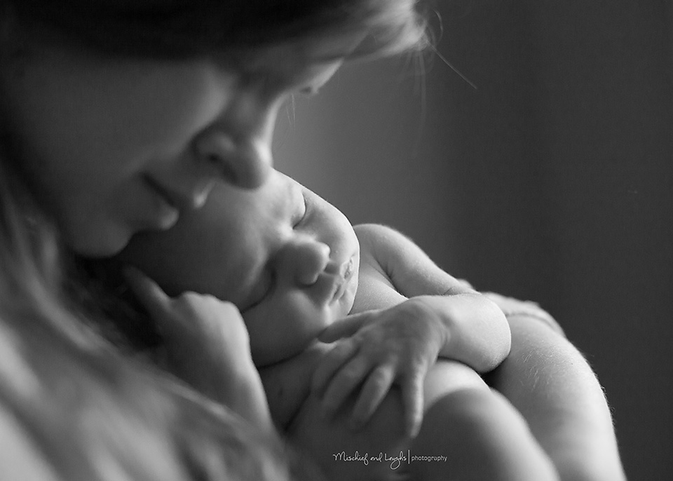 newborn in mothers arms