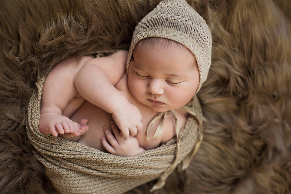 newborn baby fur, Rochester Newborn Photographer, Mischief and Laughs Photography