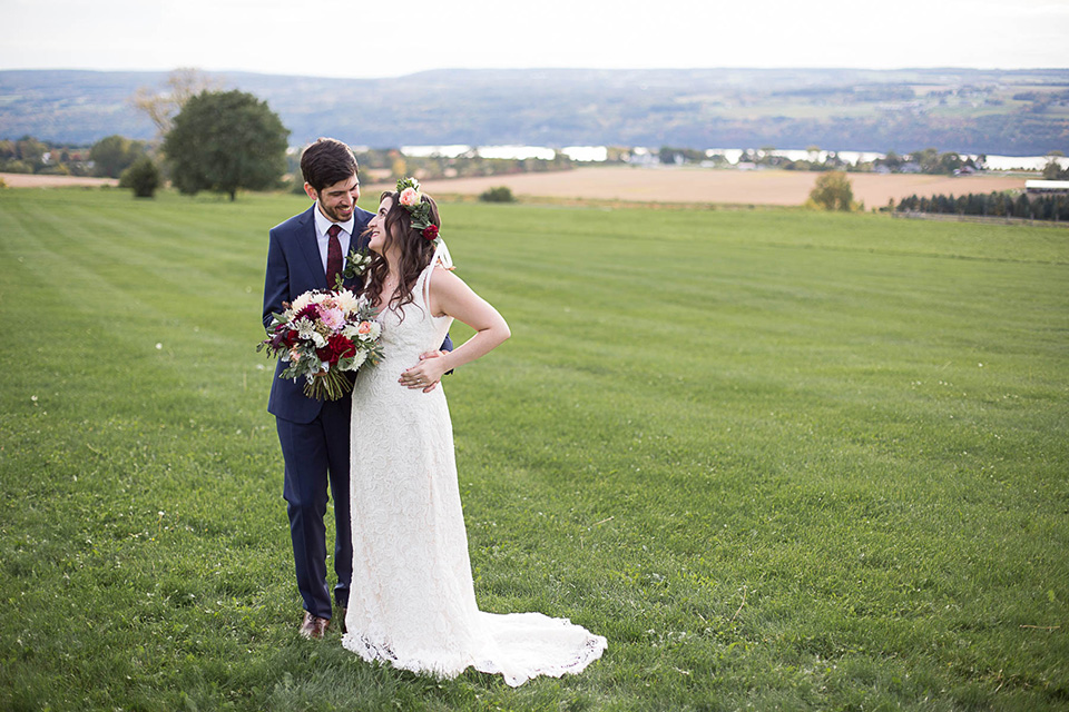 Happy couple overlooking the Seneca Lake, Logan Ridge Estates Wedding, Finger Lakes Photographer