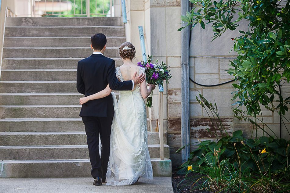 Bride and groom walk together to reception