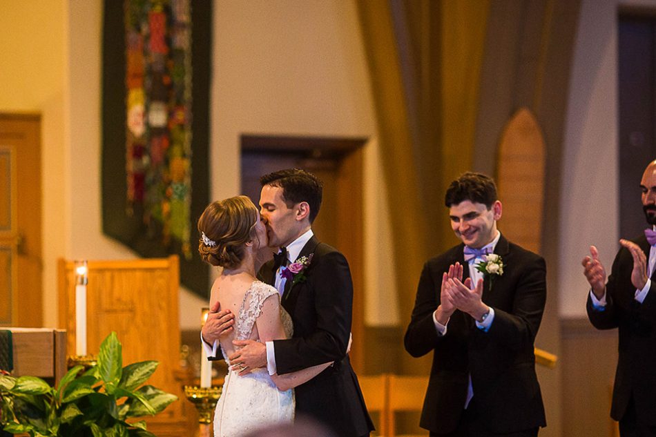 bride and groom's first kiss as husband and wife, St Clare church Cincinnati OH