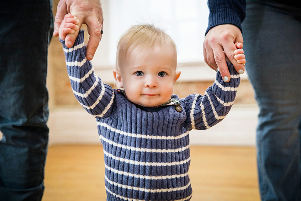 Smiling baby boy looking at the camera during his first birthday photoshoot in Cincinnati.
