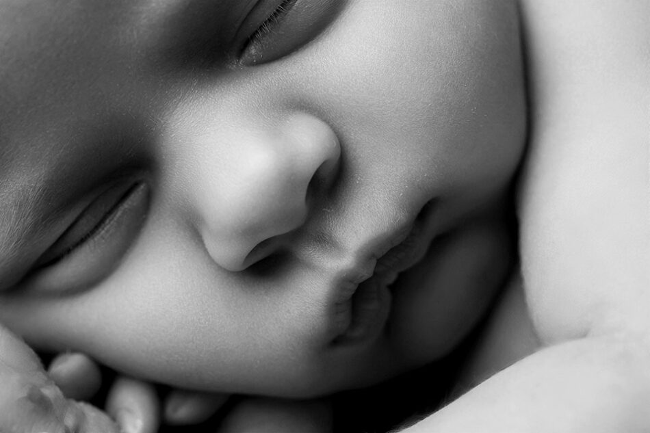 Close-up of tiny newborn hands during professional newborn session in Cincinnati